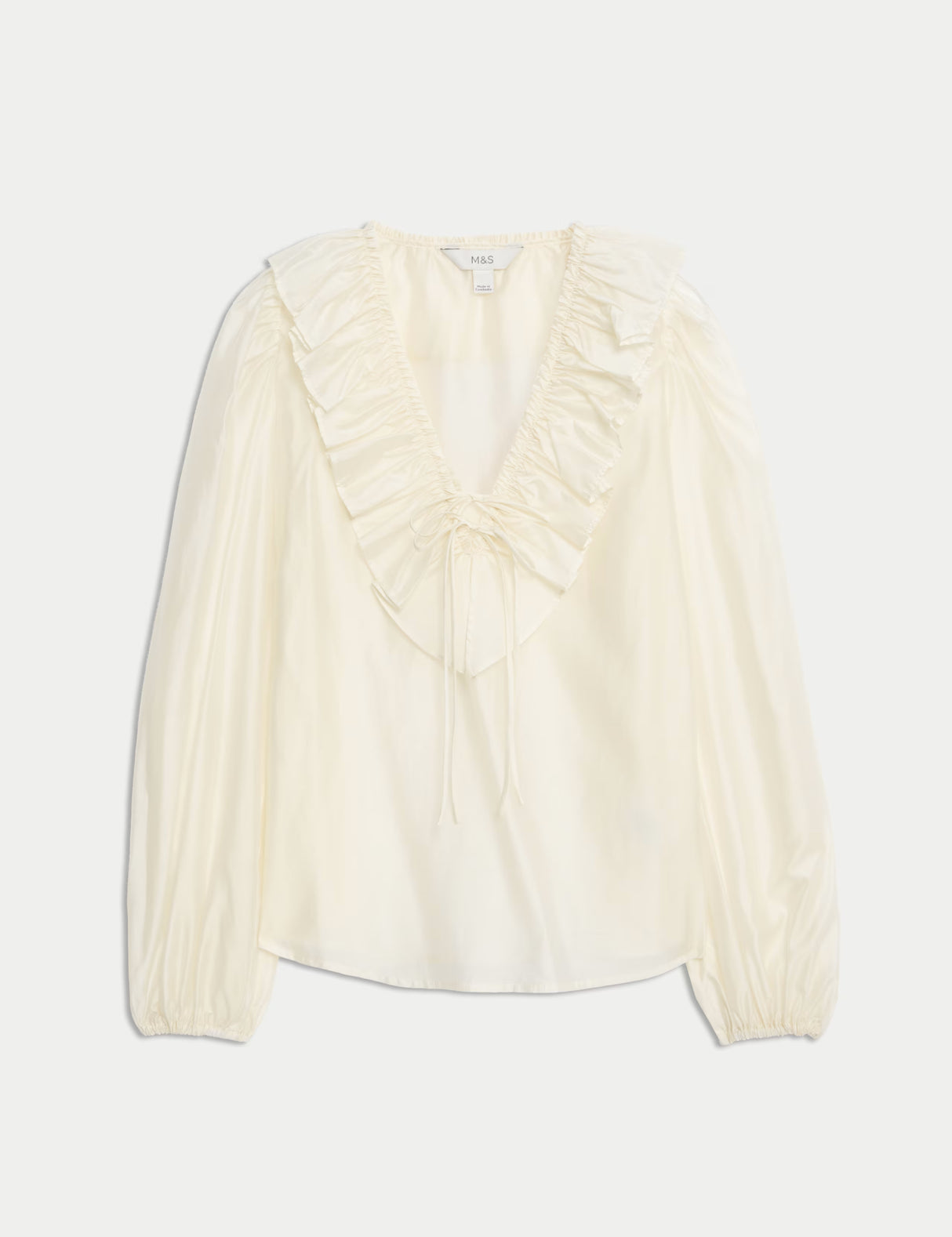 Blusa de manga larga con volante