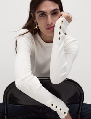 Jersey con detalle de botón en la manga