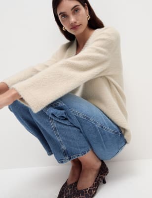 Top tipo jersey de manga larga y escote pico