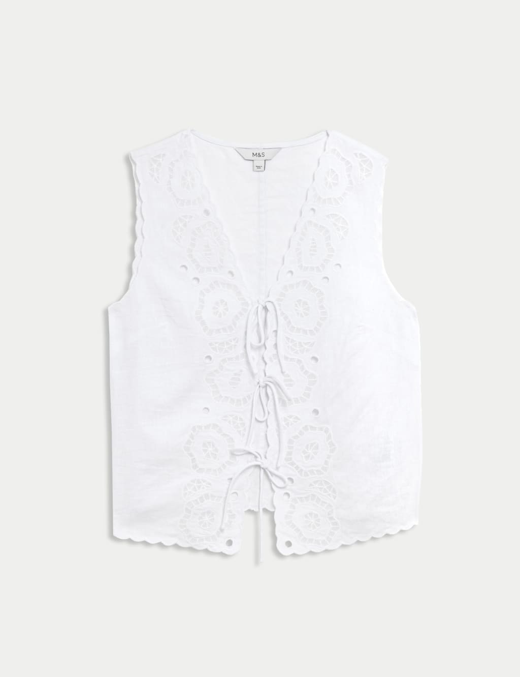 Blusa de lino sin mangas calada y detalle lazos