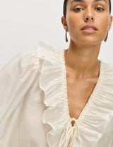 Blusa de manga larga con volante