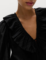 Blusa de manga larga con volante