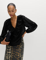 Blusa de manga larga con volante