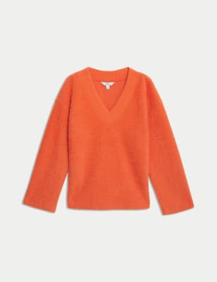 Top tipo jersey de manga larga y escote pico