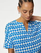 Blusa de lino con diseño de manga corta