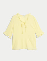 Blusa de manga corta con detalle volante